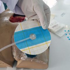 Exudate suction with suction cup trackpad